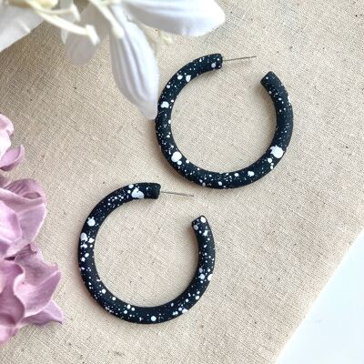 Kooky black / white paint speckle hoops earrings.