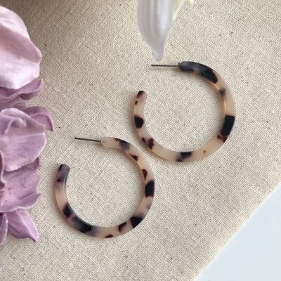 Kooky pale tortoise shell half hoop earrings.