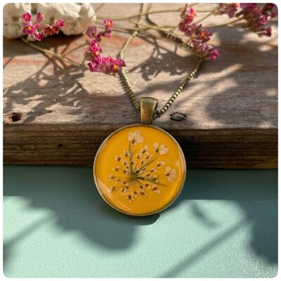 Necklace with real wild carrot blossoms in sun yellow