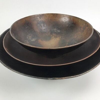 Beautiful set of three bowls made of metal and handmade in a vintage look
