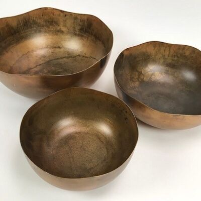 Set of three bowls with gold luster and made of metal