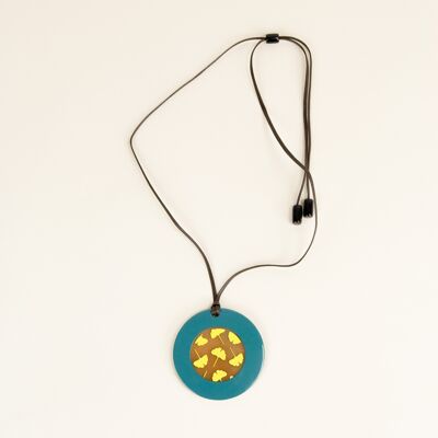 Round pendant with Ginkgo motifs with petrol green and yellow lacquer