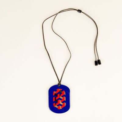 Oval pendant with Tresse motifs with indigo and orange lacquer