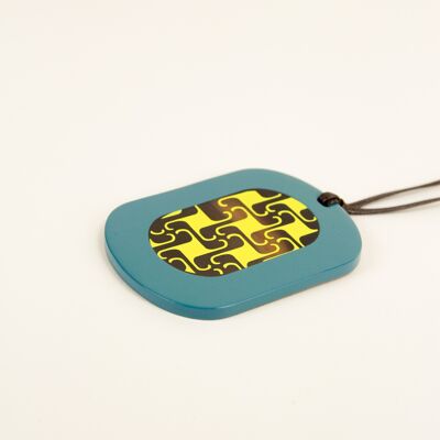 Oval pendant with geometric patterns with petrol green and yellow lacquer