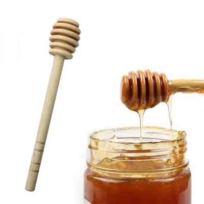 cucchiaio di miele in legno