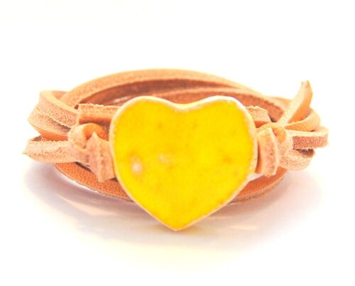 Natural leather cord with yellow ceramic heart.