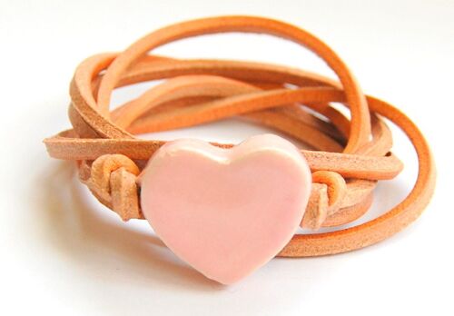 Natural leather cord with light pink ceramic heart.