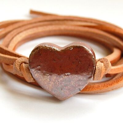 Natural leather cord with rose gold ceramic heart.