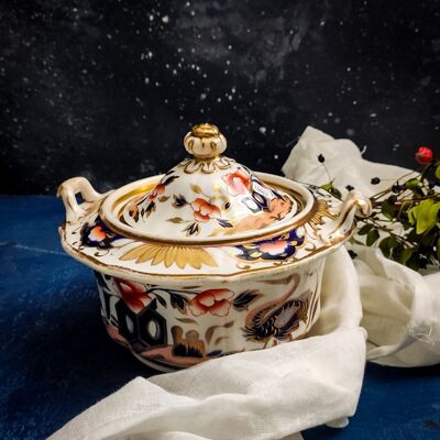 Round sugar bowl with blue, red and gold flowers
