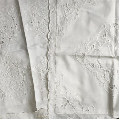 four cotton pillowcases with cutwork embroidery