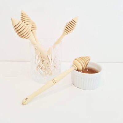 cucchiai di miele in legno