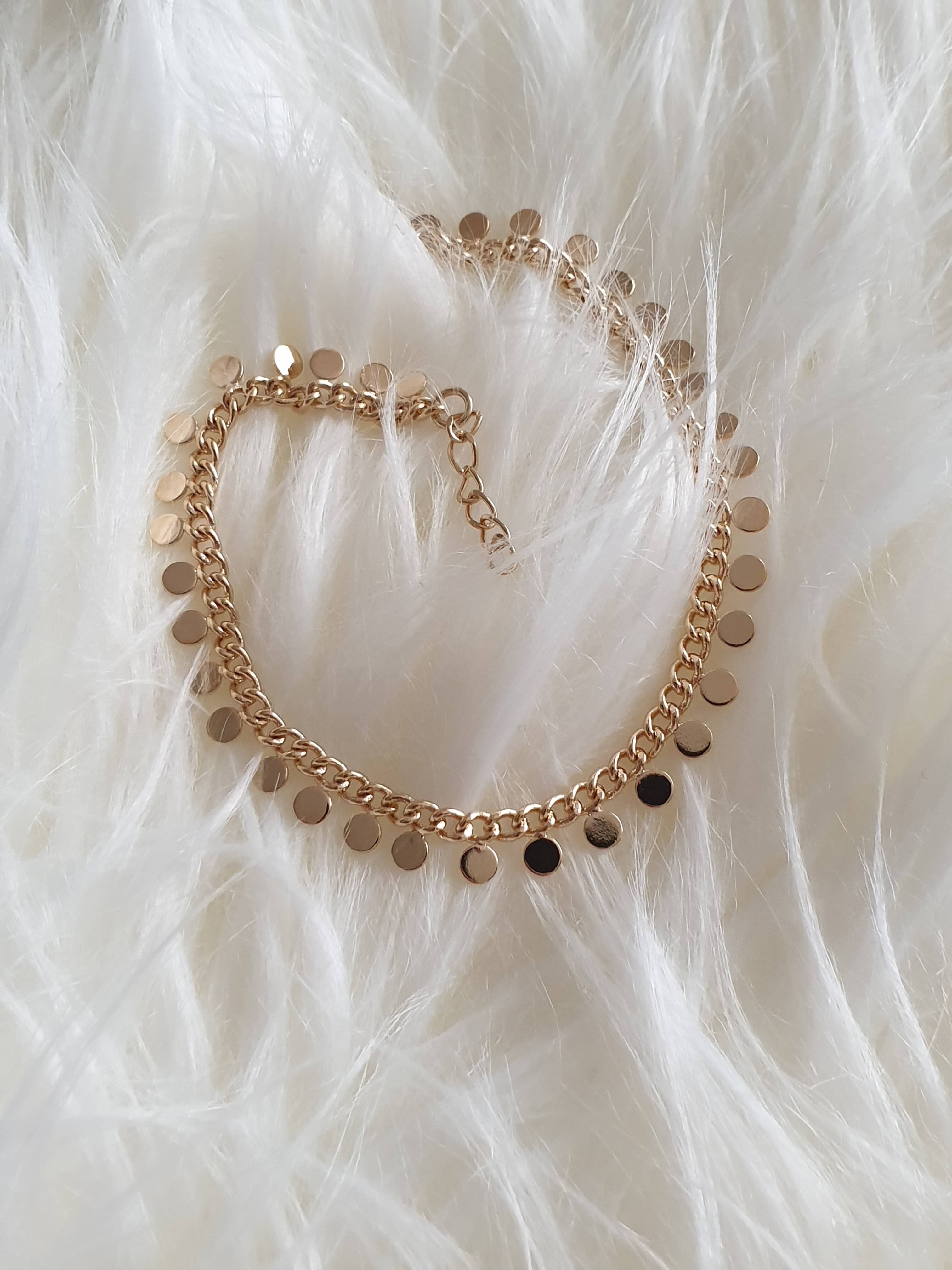 Bracciale placcato oro, con piccole nappine a pastiglia