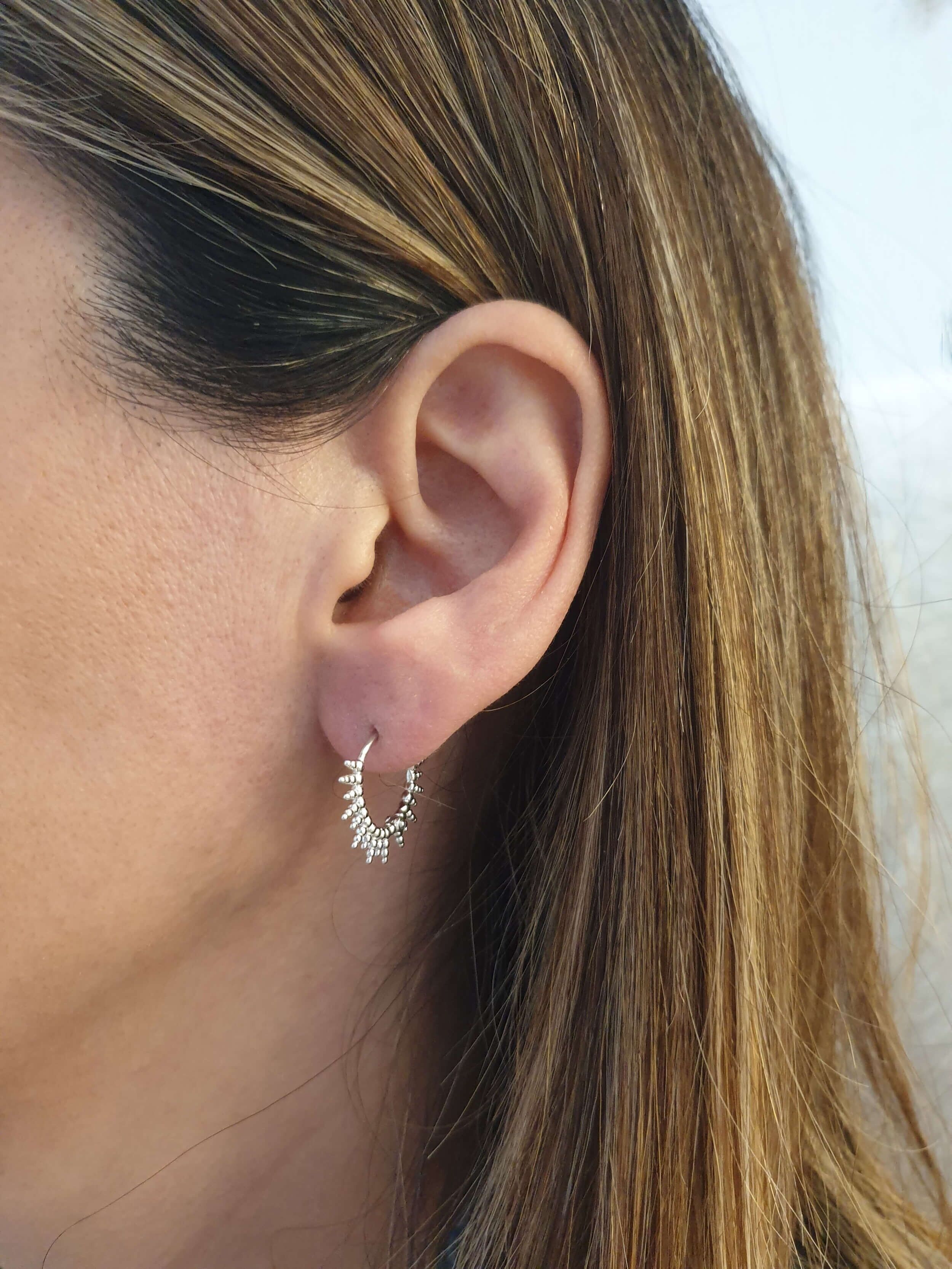 Aros motivo sol de plata rodiada 925/1000