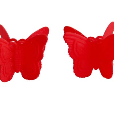 2 horquillas de mariposa rojas.