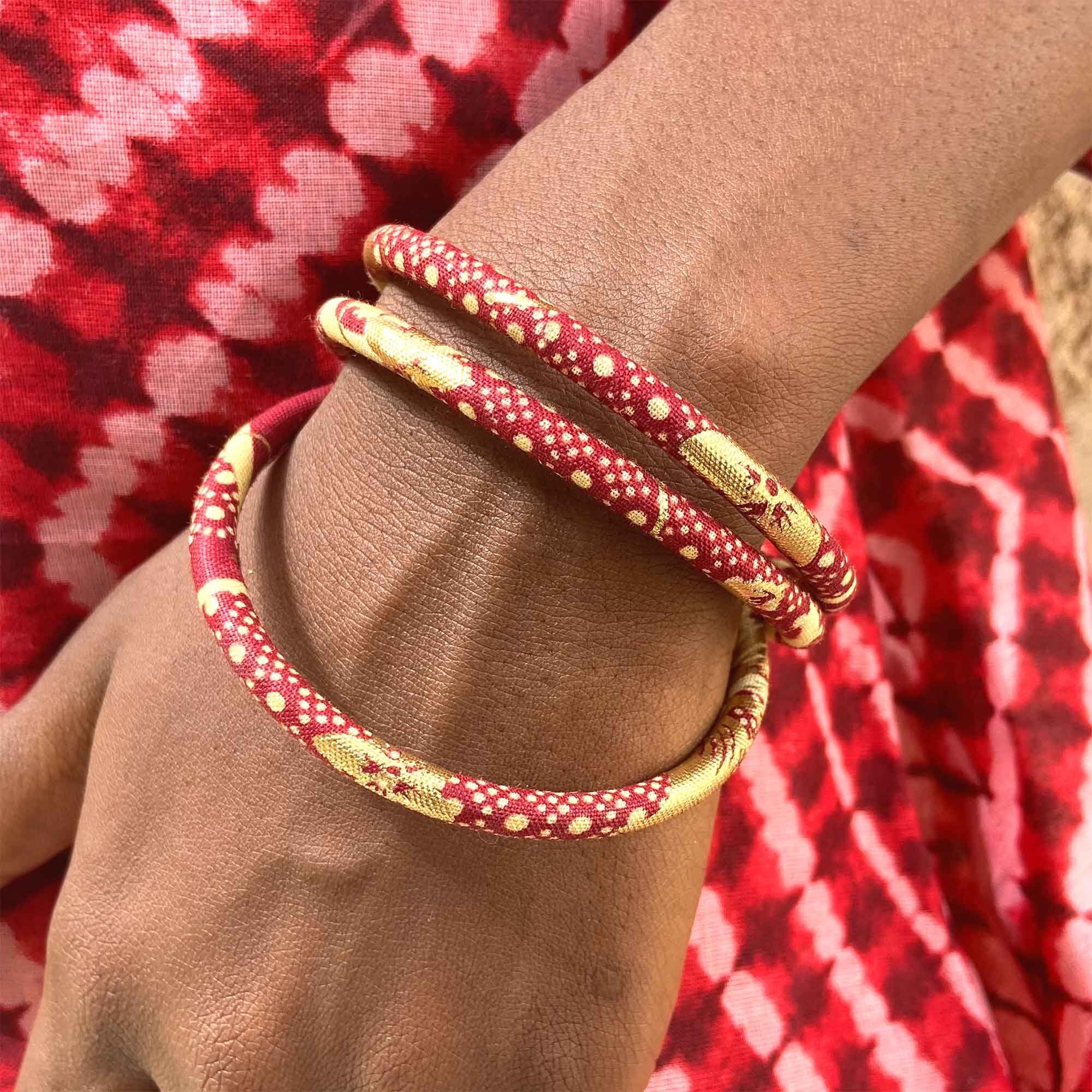 Bracciali in cera rossa/ecru/oro