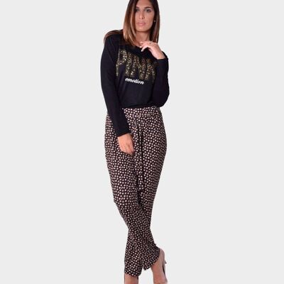 Trousers in micro patterned knit with bow on the front