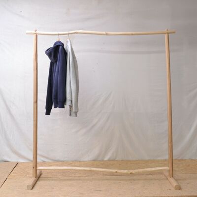 Clothes rack in natural wood, bohemian atmosphere