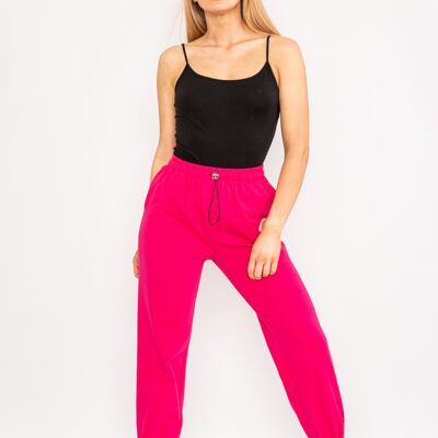 Pantaloni cropped fucsia con coulisse e orsetto