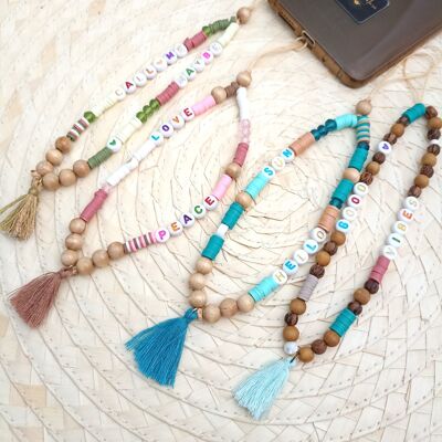 Charm smartphone jewel in heishi beads, crystal, wood, cotton and synthetic resin