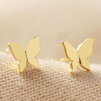 Puces d'oreilles minuscules papillons en or brossé