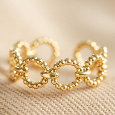 Anello regolabile con catena di perline in oro