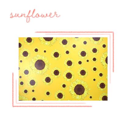 Packung mit Sonnenblumen-Geschenkpapier und Geschenkanhänger