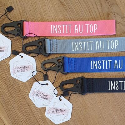 "INSTIT AT THE TOP" key ring