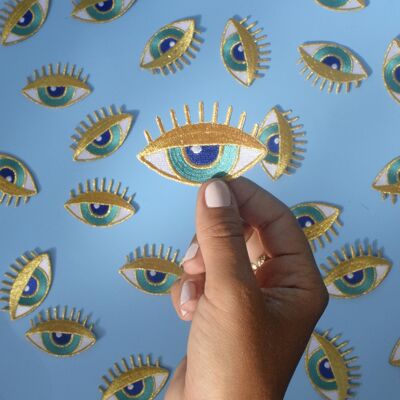 Gold eye iron-on patch