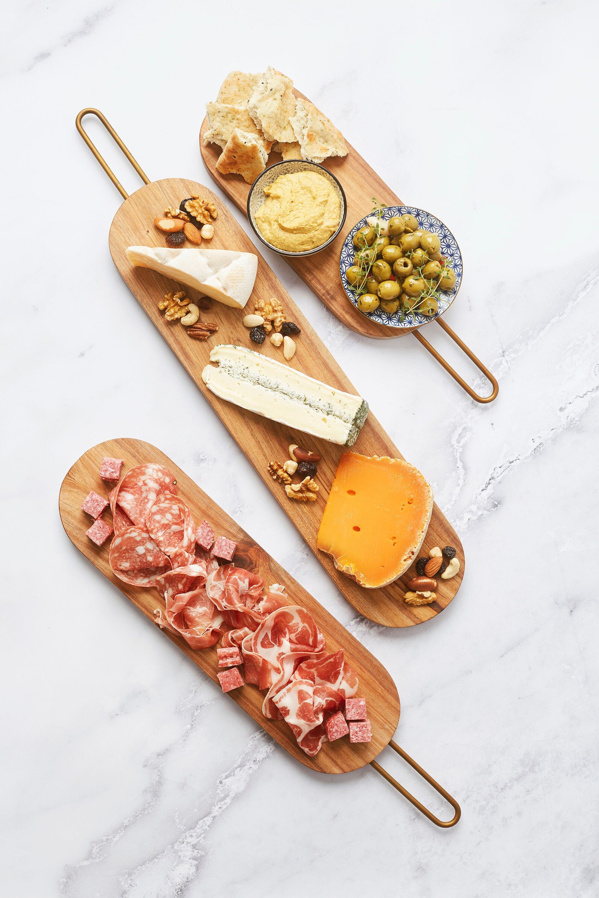 Tablero de madera de acacia con mango de cobre 40x12x2cm