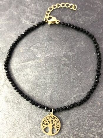 Bracelet avec arbre en acier inoxydable plaqué or avec pierres noires 1