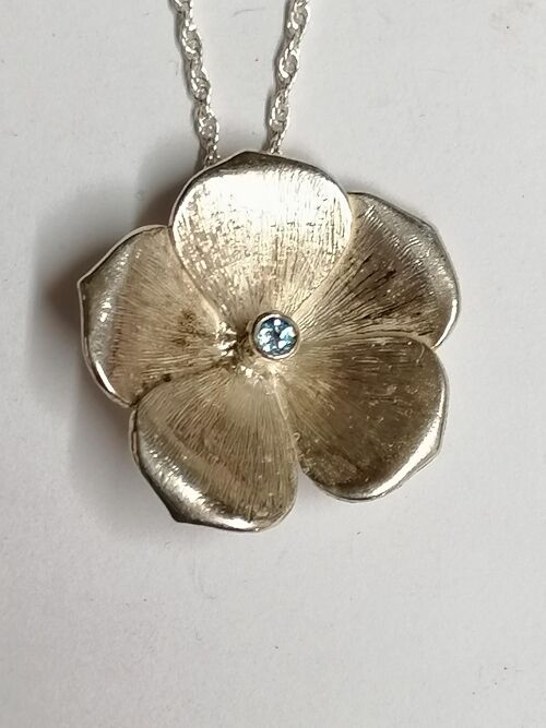 Flax pendant hand made from Silver set with a Blue Topaz