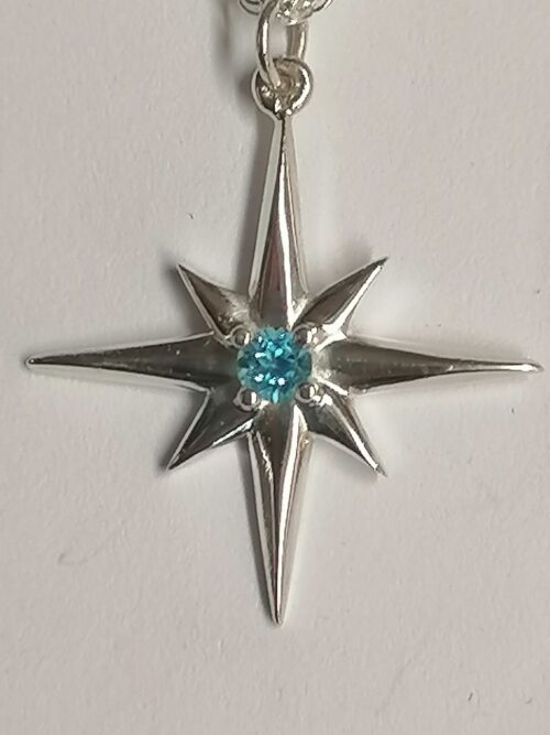 Star pendant hand made from Sterling Silver set with a Blue Topaz stone