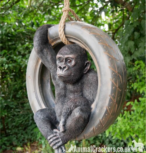 Gorilla swinging on old tyre rope swing, novelty tree garden ornament decoration, monkey or ape lover gift