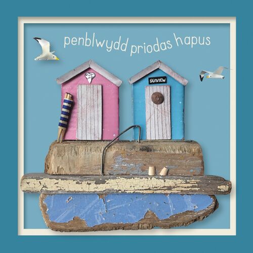 Penblwydd priodas hapus (beach huts) Welsh anniversary card