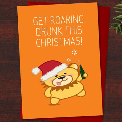 Cartolina di Natale con leone divertente "Diventa ubriaco ruggente questo Natale!" Gioco di parole per amante del gin, animali brilli nello spirito natalizio