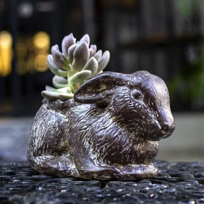 Clay flower pot, brown rabbit sitting