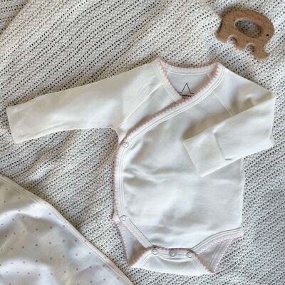 Organic baby bodysuit with pink border