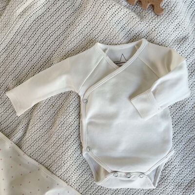 Long-sleeved organic baby bodysuit with pink stars