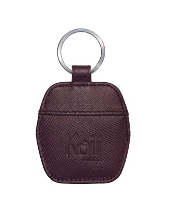 K10854XB | Porte-clés en cuir Saffiano véritable. Couleur bordeaux. Porte-clés en nickel poli. Dimensions totales : 5,5 x 9,5 x 0,5 cm. Conditionnement : Boîte cadeau fond/couvercle rigide 1