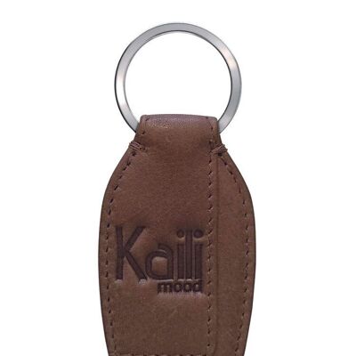 K10753IB | Keychain in genuine full grain leather, with slight grain. Mud color. Polished Nickel ring. Total dimensions: 3.5 x 9 x 0.5 cm. Packaging: rigid bottom/lid Gift Box