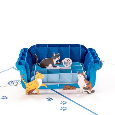 Tarjeta emergente de gato y sofá