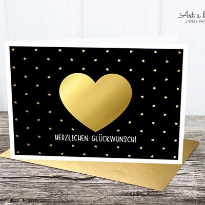 Folded card: gold heart, black M.