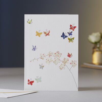 Biglietto di auguri con farfalle e orchidee