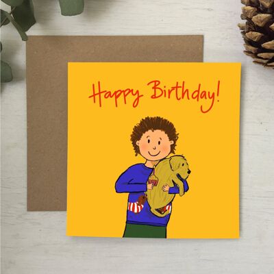 Niño con tarjeta de cumpleaños de cachorro