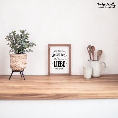 Farmhouse Design Schild "Die geheime Zutat ist immer Liebe" - 21x30 - mit Rahmen