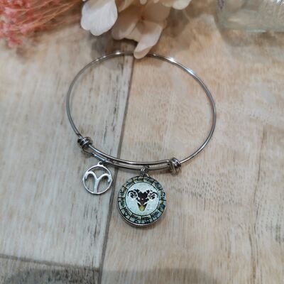 Brazalete de acero con signo astrológico