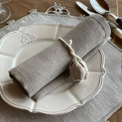Round gray linen and cotton placemat decorated with handmade lace