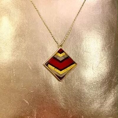 Reversible red gold wax print and leather pendant