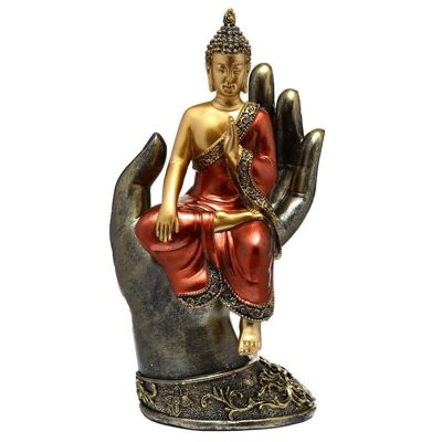 Buda tailandés dorado y rojo sentado en una mano