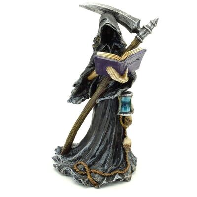 La figurine de la faucheuse avec le livre des morts et la faux